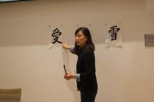 Kiri Lee teaching ASIA 090 students how to do calligraphy