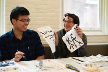 Lehigh Lunar New Year Celebration participants practice Japanese caligraphy