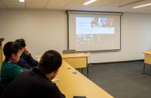 Students and faculty of Lehigh University view the presentation at the Asian Studies Spring Social
